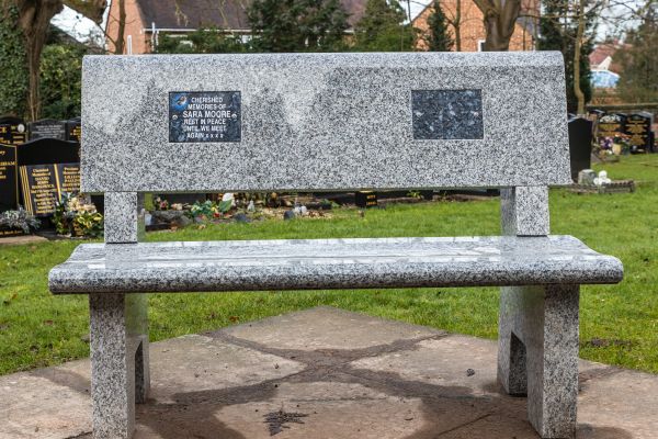 A granite memorial bench at Astwood