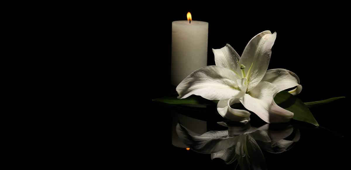 A candle and flower